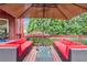 Inviting outdoor deck with comfortable seating and views of the green, landscaped backyard at 3364 Kylee Dawn Cir, Lawrenceville, GA 30045