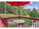 Relaxing backyard deck with patio furniture and serene views of the landscaped lawn at 3364 Kylee Dawn Cir, Lawrenceville, GA 30045