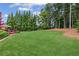 Vast backyard with a large lawn and a view of the home at 3364 Kylee Dawn Cir, Lawrenceville, GA 30045