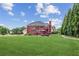 Expansive backyard featuring a large lawn and a multi-level deck, perfect for outdoor entertaining at 3364 Kylee Dawn Cir, Lawrenceville, GA 30045