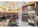 Entertain in style with this elegant bar area, featuring a stainless steel refrigerator, and ample storage space at 3364 Kylee Dawn Cir, Lawrenceville, GA 30045