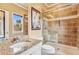 Bathroom featuring a granite sink and a tiled glass shower at 3364 Kylee Dawn Cir, Lawrenceville, GA 30045