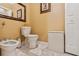 Cozy bathroom featuring a bidet, toilet, decorative mirror and cabinet at 3364 Kylee Dawn Cir, Lawrenceville, GA 30045