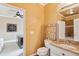 Well-lit bathroom with a granite countertop, sink, and modern fixtures at 3364 Kylee Dawn Cir, Lawrenceville, GA 30045