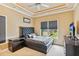 Comfortable bedroom with a tufted headboard and a view to the backyard at 3364 Kylee Dawn Cir, Lawrenceville, GA 30045