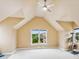 This spacious bonus room features vaulted ceilings, multiple windows, and a ceiling fan at 3364 Kylee Dawn Cir, Lawrenceville, GA 30045