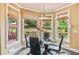 Bright breakfast nook with outdoor views, hardwood floors, and stylish pendant lighting at 3364 Kylee Dawn Cir, Lawrenceville, GA 30045