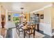 Formal dining area featuring custom millwork, hardwood floors, and backyard views at 3364 Kylee Dawn Cir, Lawrenceville, GA 30045