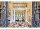 Impressive foyer showcasing high ceilings, columns, marble floors, and a view into the living area at 3364 Kylee Dawn Cir, Lawrenceville, GA 30045