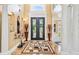 Grand foyer with high ceilings, marble floors, double doors and elegant columns at 3364 Kylee Dawn Cir, Lawrenceville, GA 30045