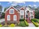Beautiful red brick two-story home with manicured landscaping and a grand entrance at 3364 Kylee Dawn Cir, Lawrenceville, GA 30045