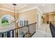 Hallway with decorative lighting and arched window offering scenic view of the neighborhood at 3364 Kylee Dawn Cir, Lawrenceville, GA 30045
