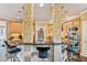 Kitchen island with breakfast bar, granite countertops, stainless steel appliances, and stylish pendant lighting at 3364 Kylee Dawn Cir, Lawrenceville, GA 30045