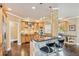 Well-appointed kitchen with breakfast bar, stone pillar, stainless appliances, and rich wood cabinets at 3364 Kylee Dawn Cir, Lawrenceville, GA 30045