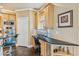 Kitchen office space featuring custom cabinetry, stainless steel appliances, and hardwood floors at 3364 Kylee Dawn Cir, Lawrenceville, GA 30045