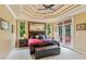 Main bedroom with a large decorative mirror over the bed and access to a private balcony at 3364 Kylee Dawn Cir, Lawrenceville, GA 30045