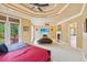 Spacious main bedroom with fireplace, trey ceiling, balcony access, and carpeted floors at 3364 Kylee Dawn Cir, Lawrenceville, GA 30045