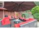 Secluded patio with a fire pit and plenty of seating at 3364 Kylee Dawn Cir, Lawrenceville, GA 30045