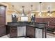 Relax in the comfort of your own home theater with a convenient bar area with modern stainless steel appliances at 3364 Kylee Dawn Cir, Lawrenceville, GA 30045