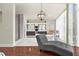 Modern bathroom with large windows, hardwood floors, and bathtub with views of the yard at 4940 Sunrise Ln, Cumming, GA 30041