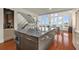 Bright kitchen with an island featuring bar seating, stainless steel appliances, and modern cabinetry at 4940 Sunrise Ln, Cumming, GA 30041
