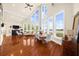 Elegant living area with high ceilings, large windows, and stylish furnishings, perfect for entertaining at 4940 Sunrise Ln, Cumming, GA 30041