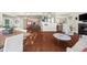 Bright, open-concept living space featuring wood floors and a gourmet kitchen with modern appliances at 4940 Sunrise Ln, Cumming, GA 30041