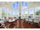 Bright and open living area with large windows, offering stunning views and ample seating at 4940 Sunrise Ln, Cumming, GA 30041