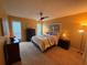 Comfortable bedroom featuring a ceiling fan, neutral color palette, and natural light from two windows at 1251 Branch, Tucker, GA 30084