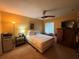 Bedroom featuring a ceiling fan, neutral color palette, and natural light from a window at 1251 Branch, Tucker, GA 30084