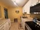 Traditional kitchen with white cabinets, stainless steel appliances, and granite countertops at 1251 Branch, Tucker, GA 30084