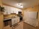 Well-equipped kitchen with granite countertops, stainless steel appliances, and ample cabinet space at 1251 Branch, Tucker, GA 30084