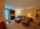 Inviting living room featuring a decorative fireplace, plush seating, and warm, neutral tones at 1251 Branch, Tucker, GA 30084