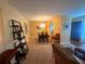 Open living room with a view into dining room featuring comfortable seating and lots of light at 1251 Branch, Tucker, GA 30084