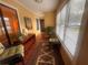 Cozy sunroom featuring lots of light, comfortable seating, stylish décor, and lovely plants at 1251 Branch, Tucker, GA 30084