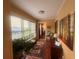 Bright sunroom with large windows, comfortable seating, and charming decorative accents at 1251 Branch, Tucker, GA 30084