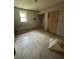 A basement with tile floors, a window, and an unfinished aesthetic at 1889 Browns Mill Se Rd, Atlanta, GA 30315