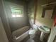Functional bathroom featuring a shower and pedestal sink at 1889 Browns Mill Se Rd, Atlanta, GA 30315