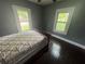 Cozy bedroom features hardwood floors at 1889 Browns Mill Se Rd, Atlanta, GA 30315