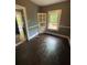 Dining room features wood floors, a built-in cabinet and a bright window at 1889 Browns Mill Se Rd, Atlanta, GA 30315