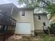 Back exterior view of home showing a garage at 1889 Browns Mill Se Rd, Atlanta, GA 30315