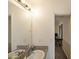 Bathroom featuring a single sink vanity with a mirror, and carpeted flooring at 37 Faithful Dr, Temple, GA 30179