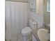 Clean bathroom featuring a toilet, vanity with sink, and a shower with a curtain at 37 Faithful Dr, Temple, GA 30179