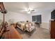 Spacious bedroom featuring neutral paint, carpet flooring, and a chair, perfect for relaxation at 37 Faithful Dr, Temple, GA 30179