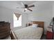 Comfortable bedroom with a ceiling fan, carpet, and a large window providing ample natural light at 37 Faithful Dr, Temple, GA 30179