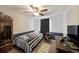 A cozy bedroom featuring blue accent wall, carpet flooring, and a large window with natural light at 37 Faithful Dr, Temple, GA 30179