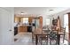 Eat-in kitchen with wooden cabinets, tile floors, and modern appliances, perfect for Gathering dining at 37 Faithful Dr, Temple, GA 30179