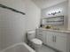 Modern bathroom with white subway tile, updated fixtures, and stylish vanity at 5685 Kingsport Dr, Sandy Springs, GA 30342