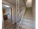 Inviting entryway with staircase and view of laundry room featuring white washer at 5685 Kingsport Dr, Sandy Springs, GA 30342