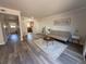 Bright, open-concept living room with wood floors, neutral decor, and natural light at 5685 Kingsport Dr, Sandy Springs, GA 30342